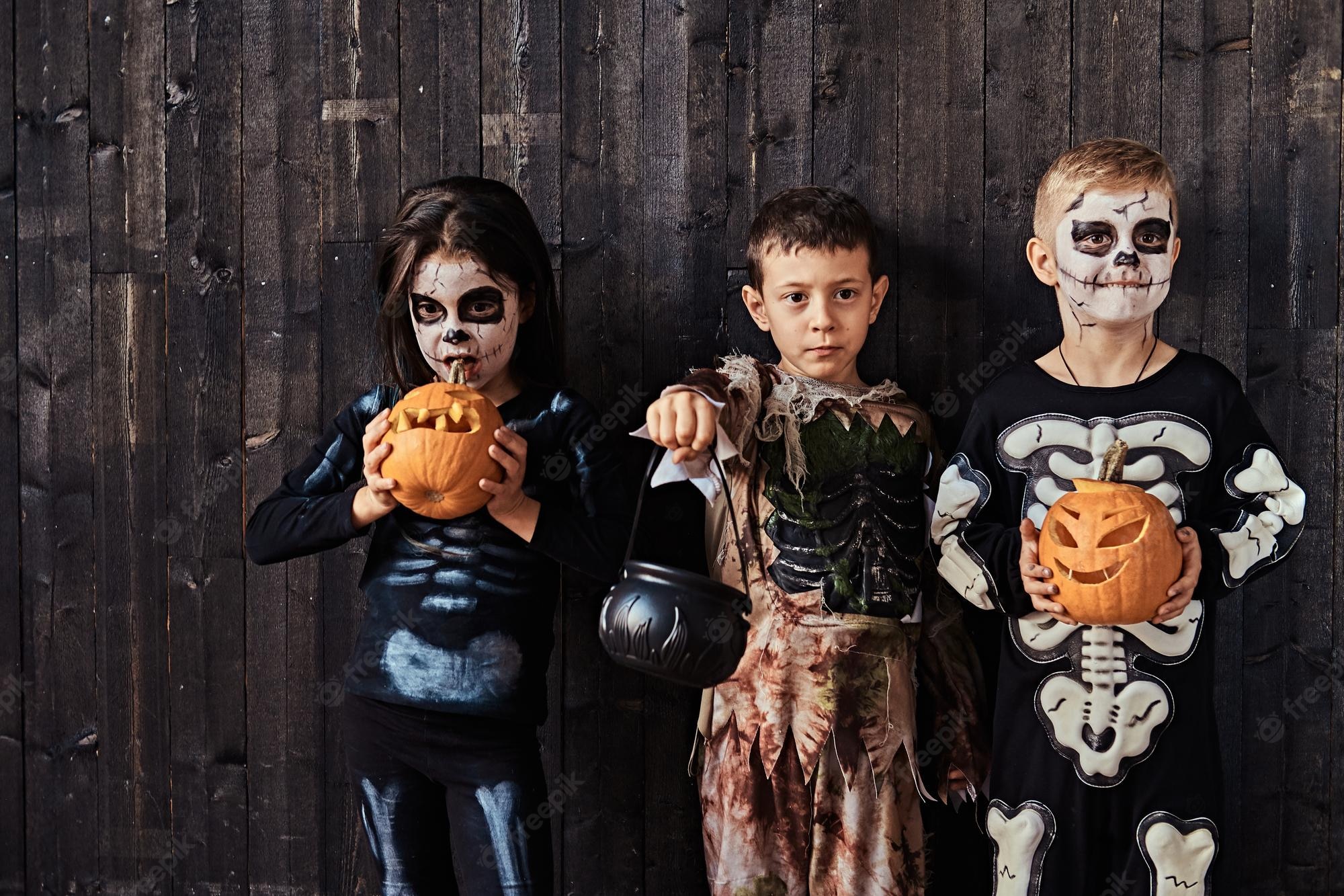 three cute kids scary costumes during halloween party old house halloween